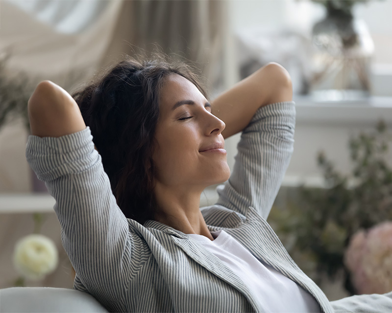 Woman leaning back on a chair